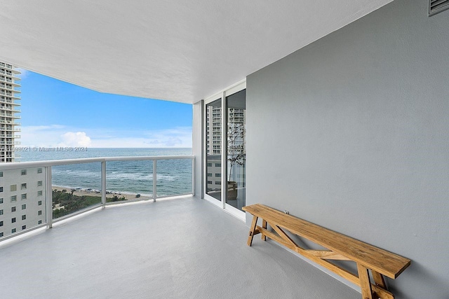 balcony featuring a water view