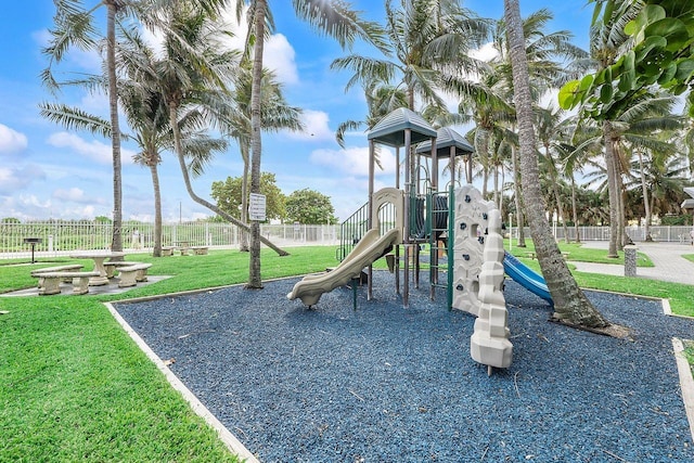 view of jungle gym with a lawn