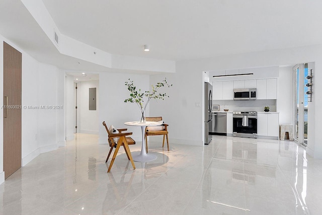 6301 Collins Ave Unit 1508, Miami Beach, FL 33141 - dining space with electric panel, light marble finish flooring, and baseboards