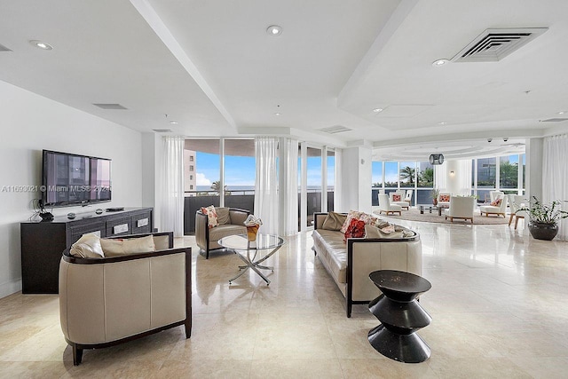 living room with floor to ceiling windows