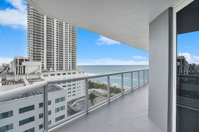 balcony featuring a water view