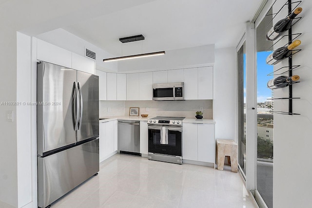 kitchen with stainless steel appliances and white cabinets