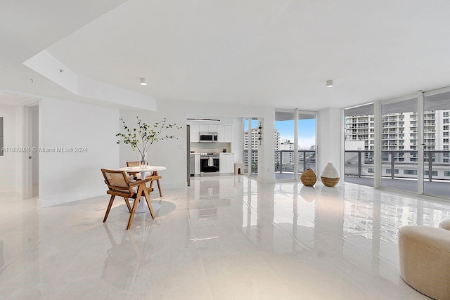 living room with a wall of windows