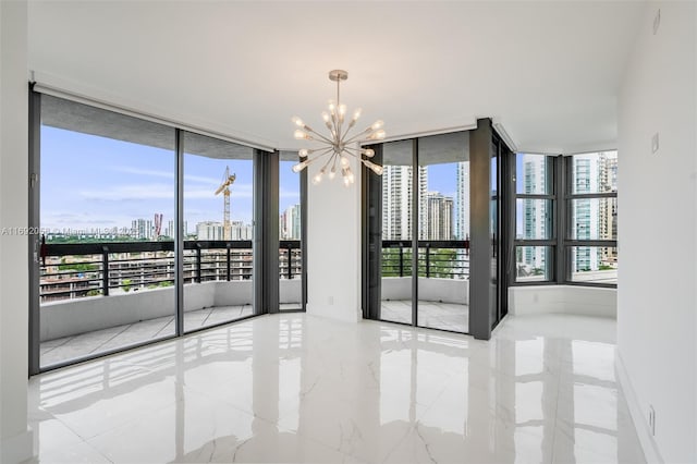 empty room featuring a view of city, floor to ceiling windows, a healthy amount of sunlight, and a notable chandelier