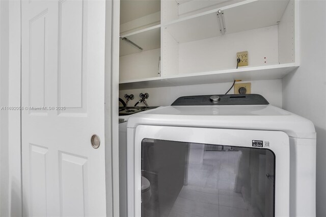 laundry area with washer and dryer