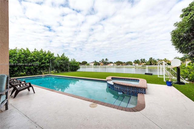 view of swimming pool with a water view, a patio, an in ground hot tub, and a yard