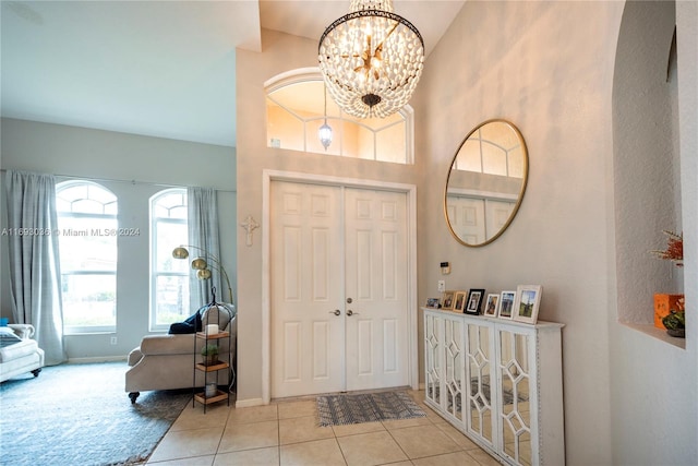 entrance foyer featuring a notable chandelier and light tile patterned floors