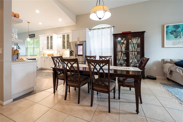 dining space featuring light tile patterned flooring