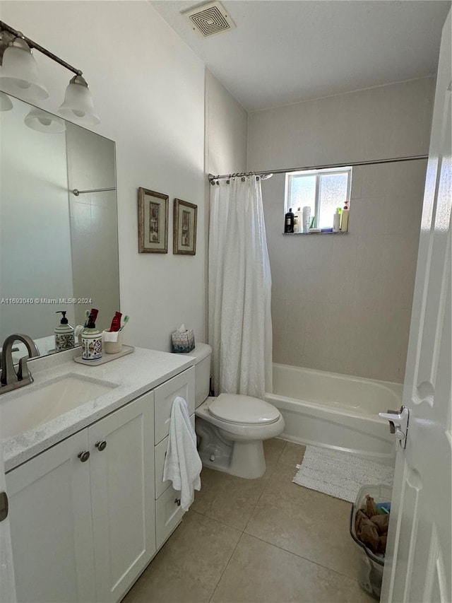 full bathroom featuring tile patterned flooring, shower / tub combo, vanity, and toilet