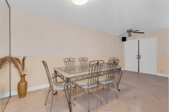 tiled dining room with ceiling fan