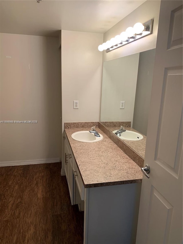 bathroom with vanity and hardwood / wood-style floors