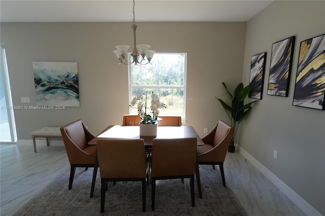 dining room featuring a notable chandelier