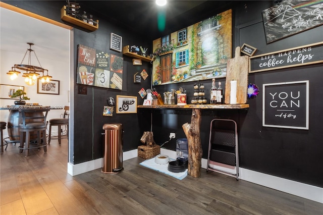 bar featuring hardwood / wood-style flooring