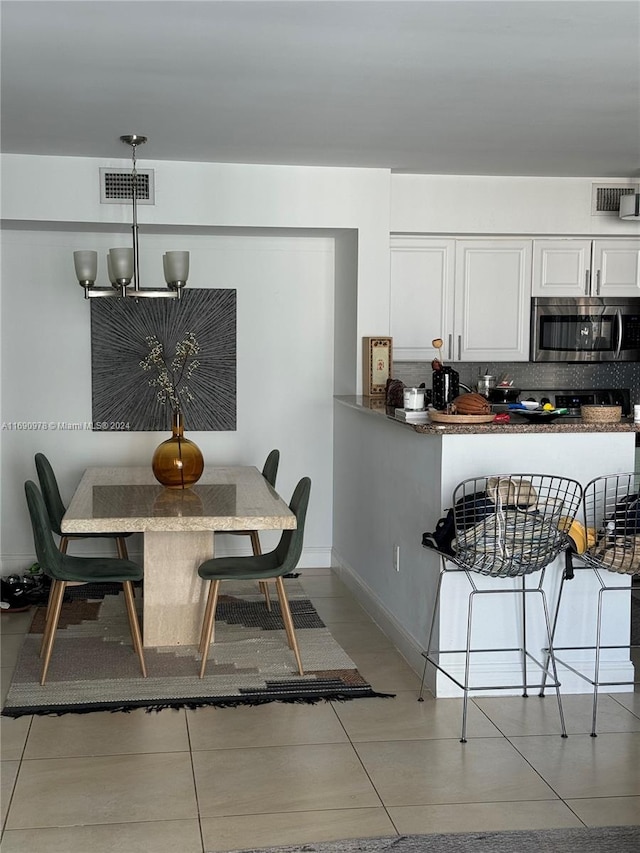 dining room featuring light tile patterned floors