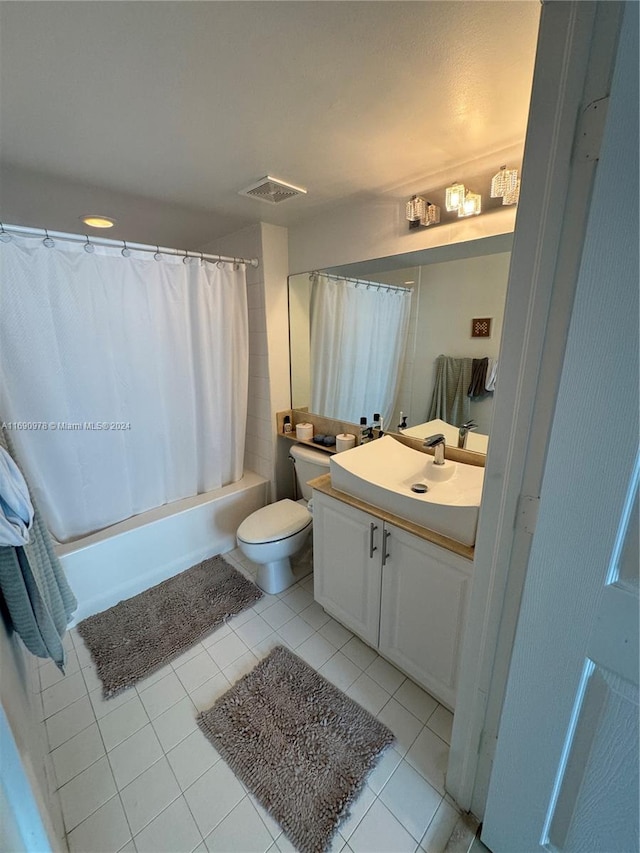 full bathroom with tile patterned flooring, vanity, shower / bath combination with curtain, and toilet