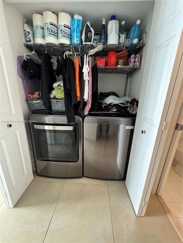 laundry room with separate washer and dryer and light tile patterned floors