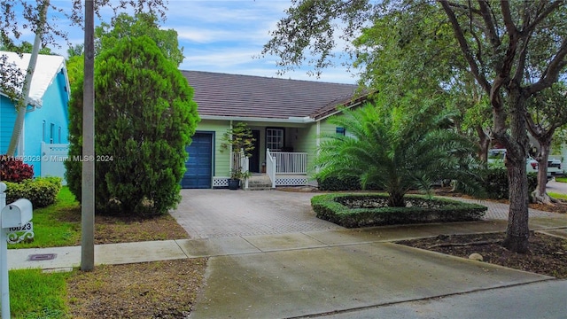 view of front of house with a garage and covered porch