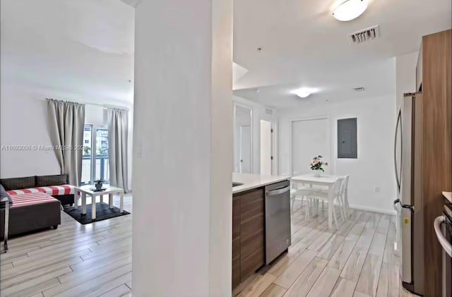 481 NE 29th St Unit 702, Miami, FL 33137 - kitchen featuring appliances with stainless steel finishes, light wood finished floors, light countertops, and modern cabinets