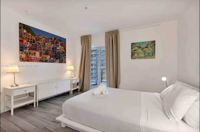 bedroom featuring hardwood / wood-style floors