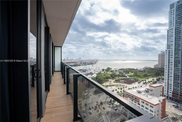 balcony featuring a water view