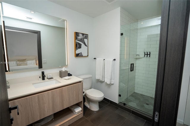 bathroom with tile patterned flooring, vanity, toilet, and a shower with door