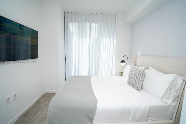 bedroom featuring hardwood / wood-style floors