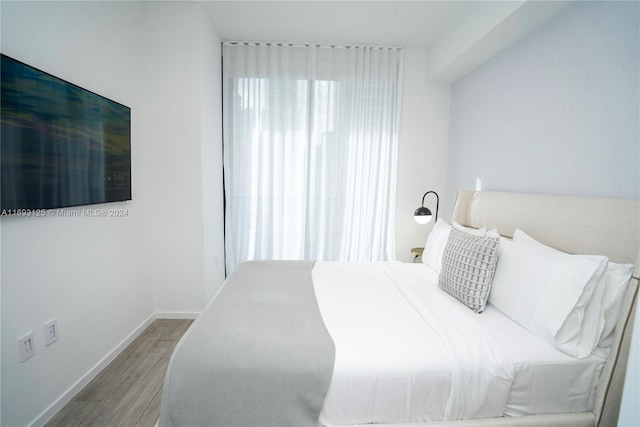 398 NE 5th St Unit 1617, Miami, FL 33132 - bedroom with wood finished floors and baseboards