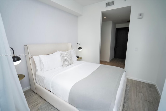 bedroom featuring light wood-type flooring