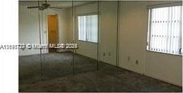 unfurnished bedroom with a closet