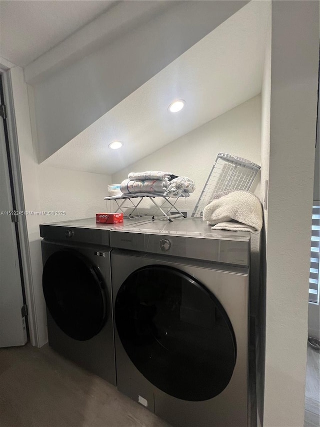 washroom with washer and dryer