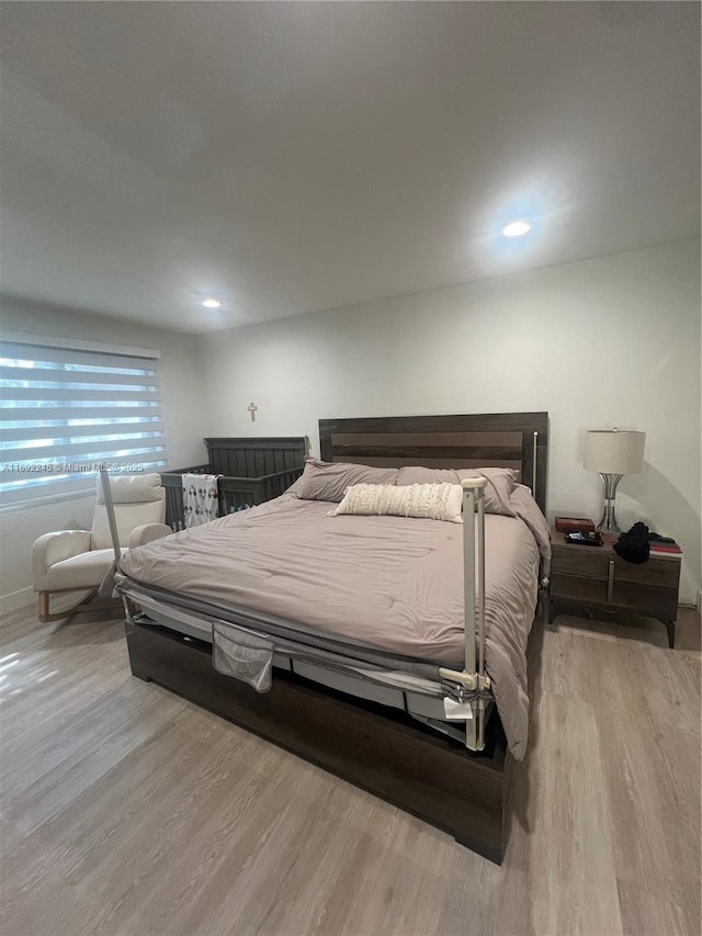 bedroom with light hardwood / wood-style flooring