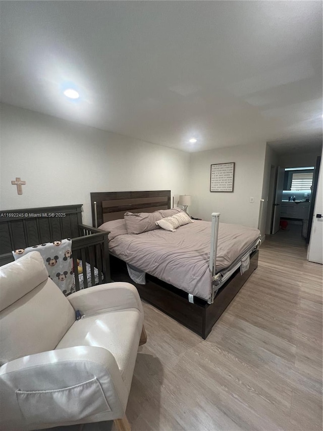 bedroom with light hardwood / wood-style flooring