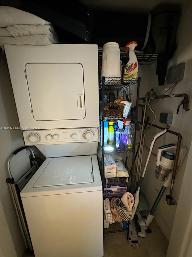 laundry room with stacked washer and dryer