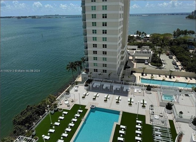 birds eye view of property featuring a water view