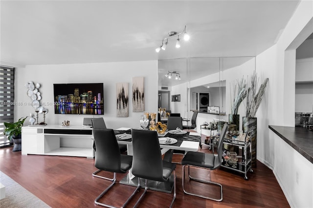 dining area with dark wood-type flooring