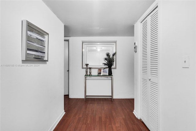 hall with dark hardwood / wood-style flooring