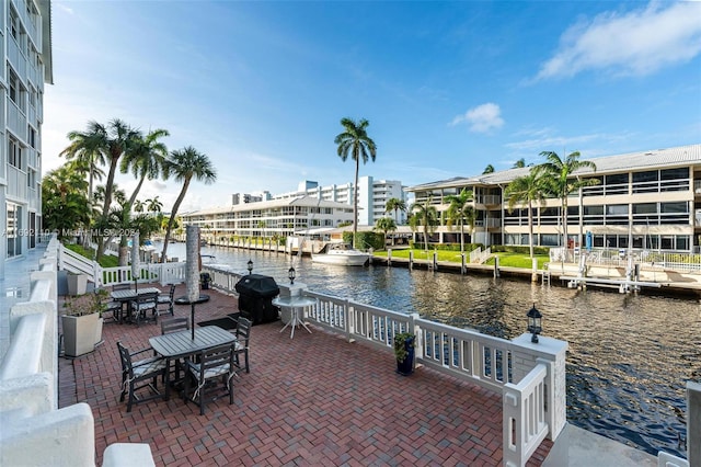 view of patio featuring a water view and area for grilling