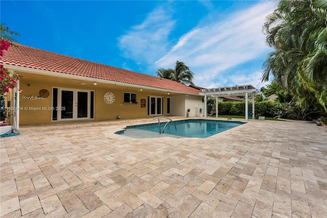 view of pool featuring french doors, a pergola, and a patio area