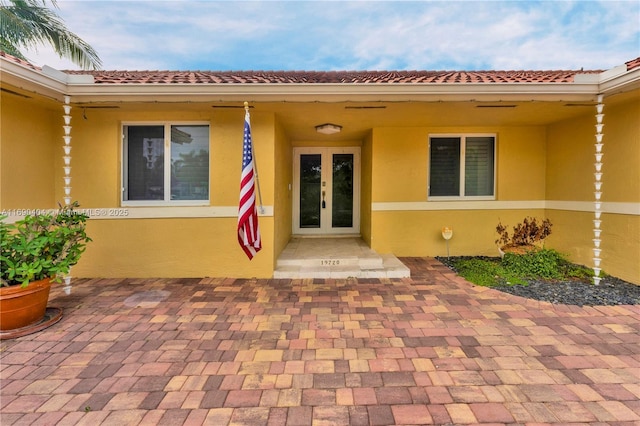 entrance to property featuring french doors