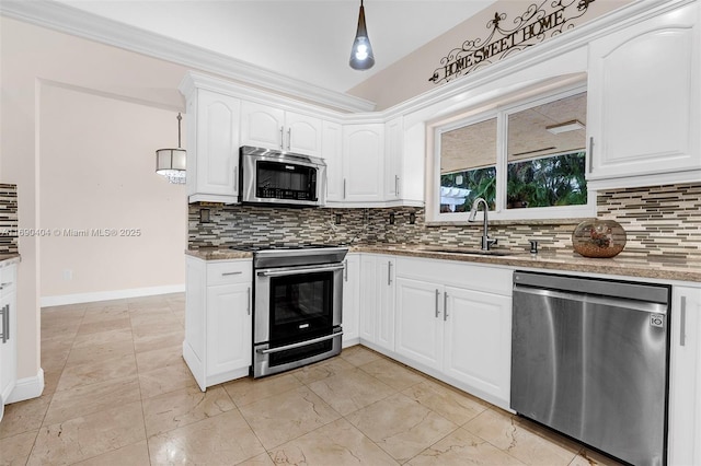 kitchen with appliances with stainless steel finishes, white cabinetry, sink, decorative backsplash, and light stone counters