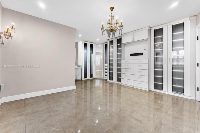 empty room featuring an inviting chandelier