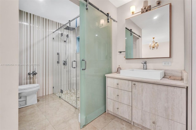 bathroom featuring vanity, a shower with shower door, tile patterned floors, and toilet