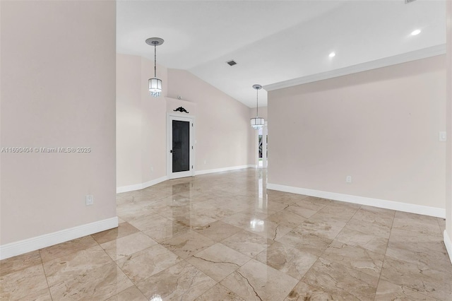 spare room with lofted ceiling