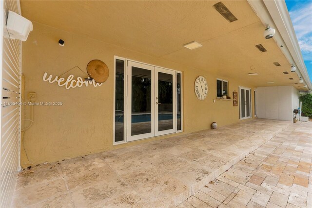 view of patio featuring french doors