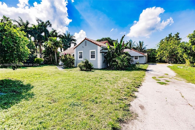 exterior space featuring a front lawn