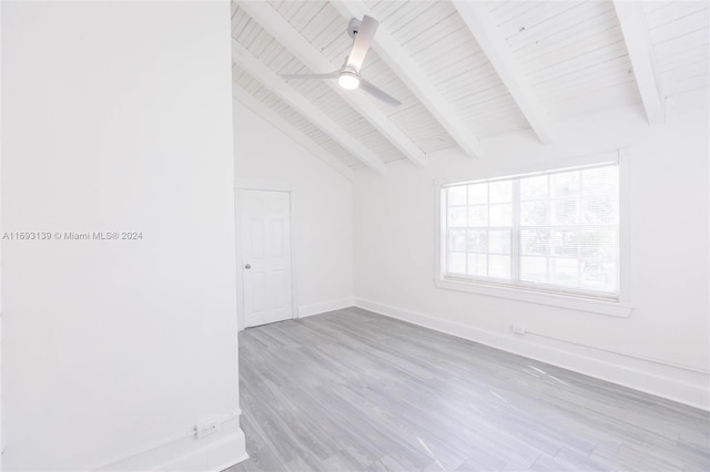 unfurnished room featuring light hardwood / wood-style floors, ceiling fan, wood ceiling, and lofted ceiling with beams