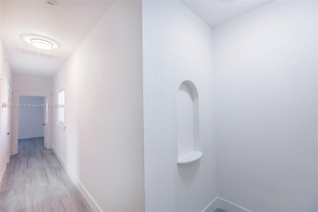 corridor featuring light hardwood / wood-style flooring