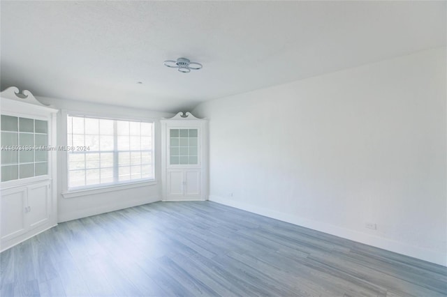 spare room featuring hardwood / wood-style floors