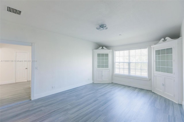 empty room with hardwood / wood-style floors