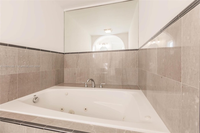 bathroom featuring a relaxing tiled tub